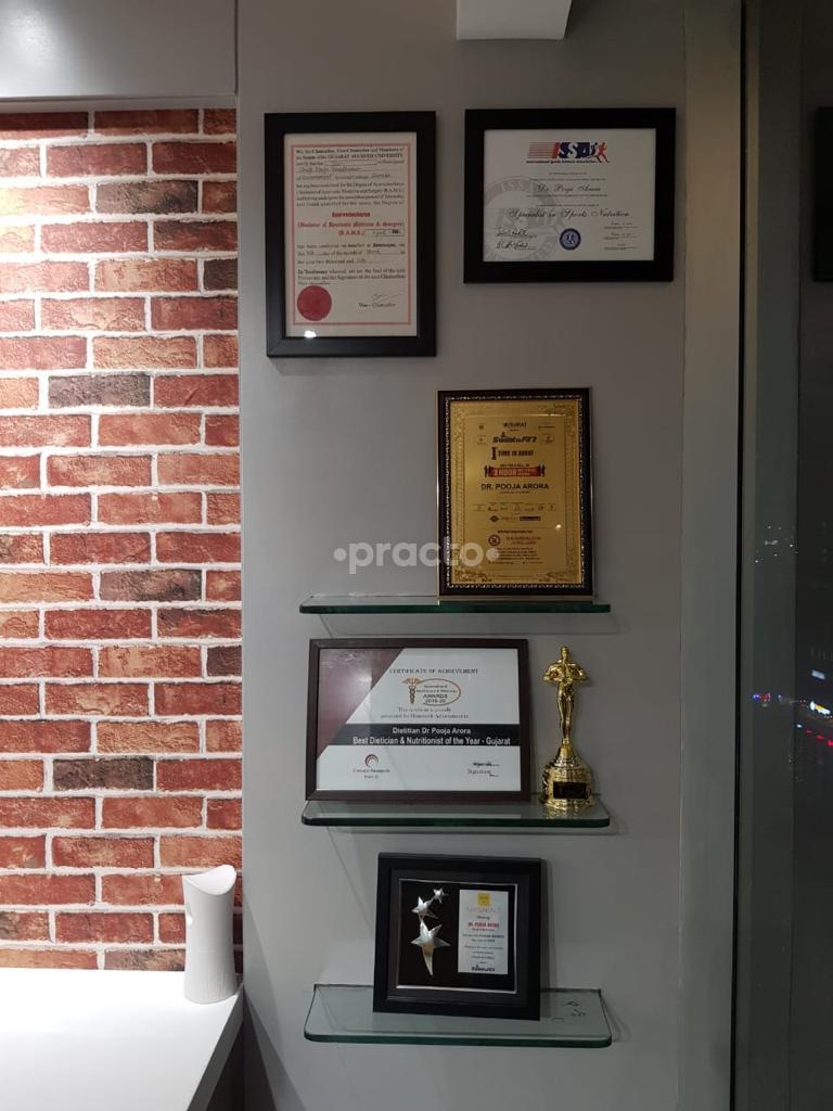 Awards & Certificates at Dr. Pooja Arora's Clinic Vesu Surat