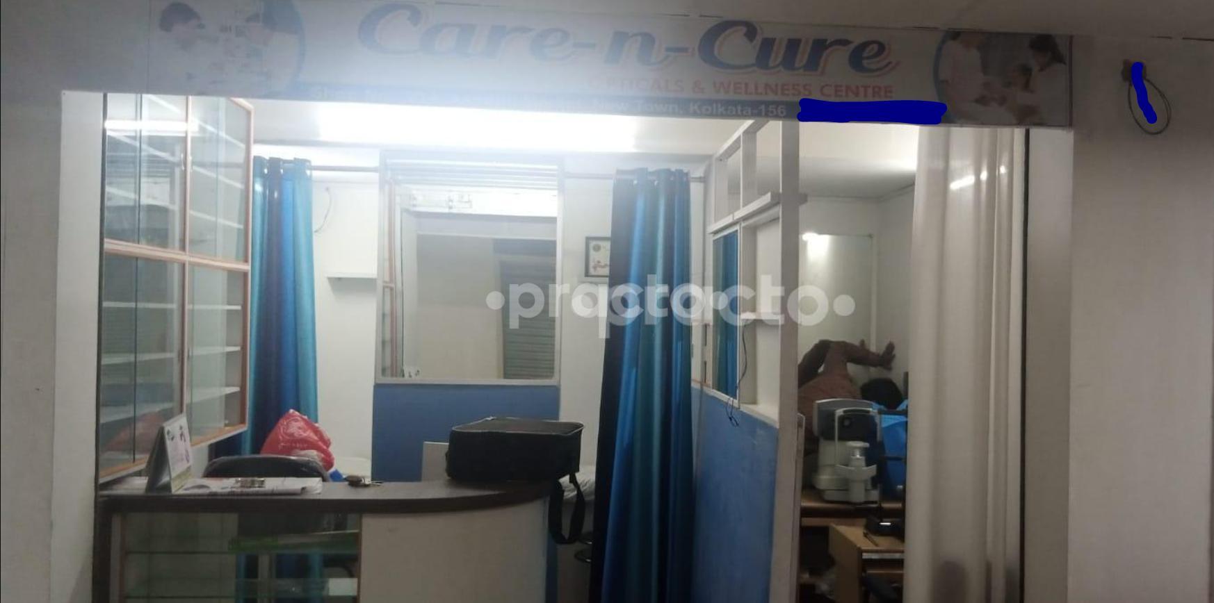 Establishment board at Care N Cure Opticals And Wellness Centre New Town Kolkata